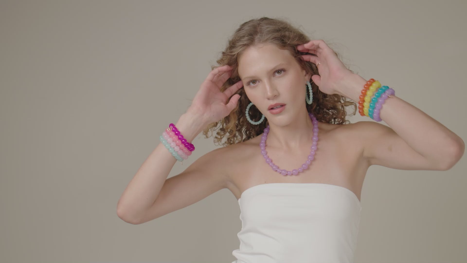 Load video: These beaded hoops will quickly become your go-to earrings! The Layla pairs effortlessly with anything in your closet while adding a splash of color to your favorite outfit! The glossy finish gives a subtle shine to each boldly colorful hue.